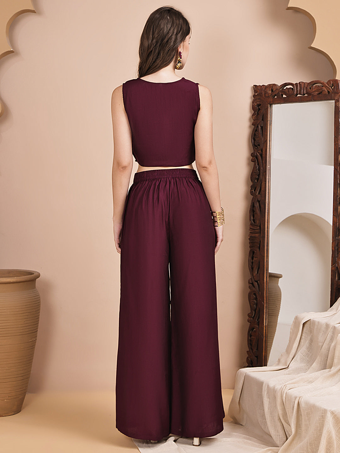 Back view of model styling wine co-ord outfit