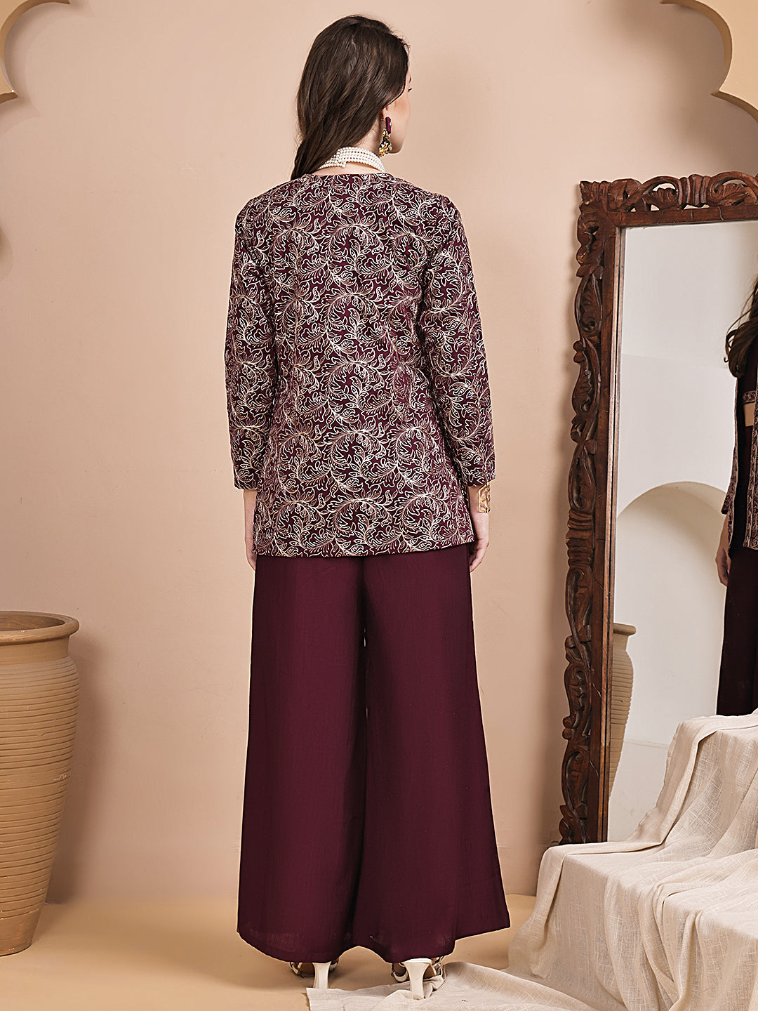 Back view of model styling wine co-ord outfit
