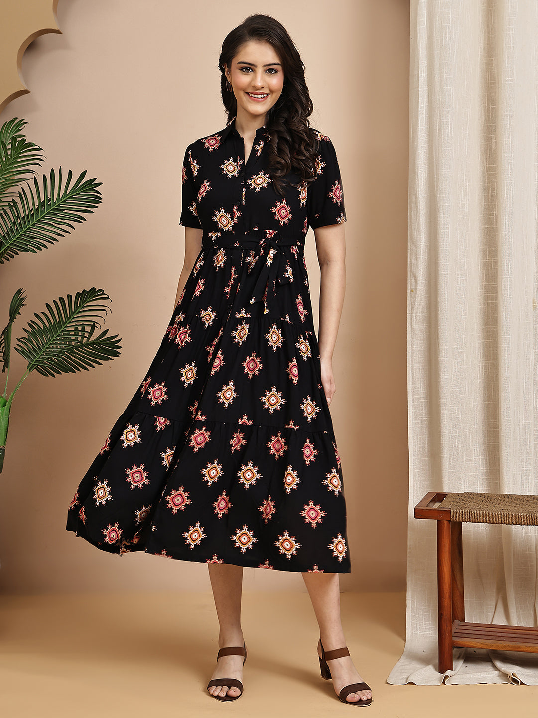 Woman wearing black floral printed dress