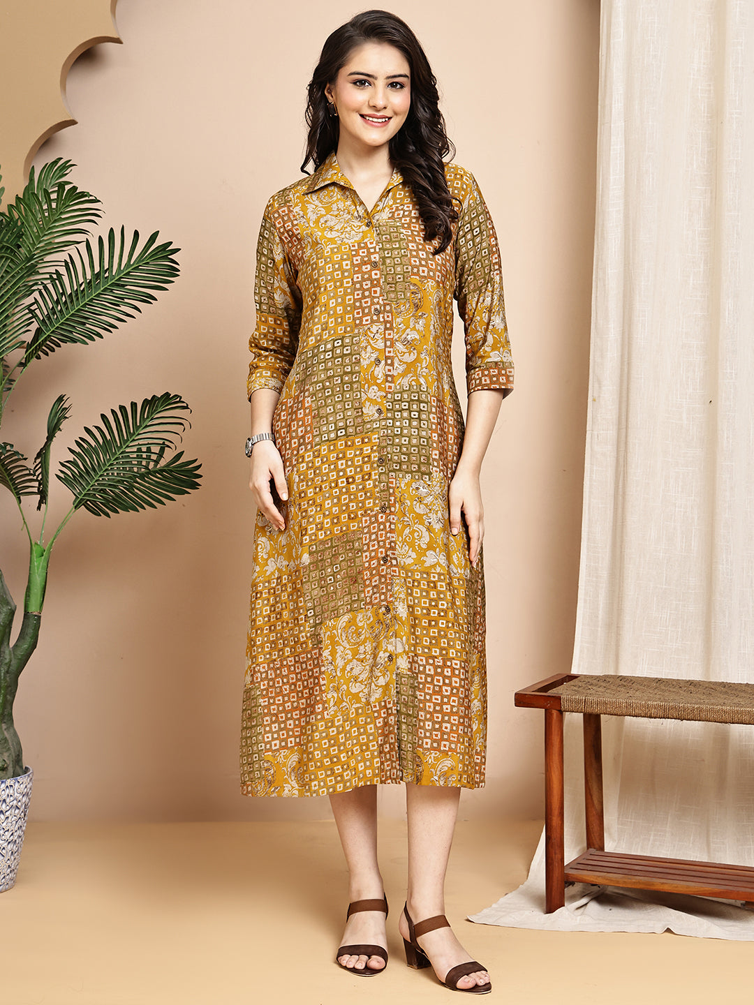 Woman wearing mustard abstract printed dress