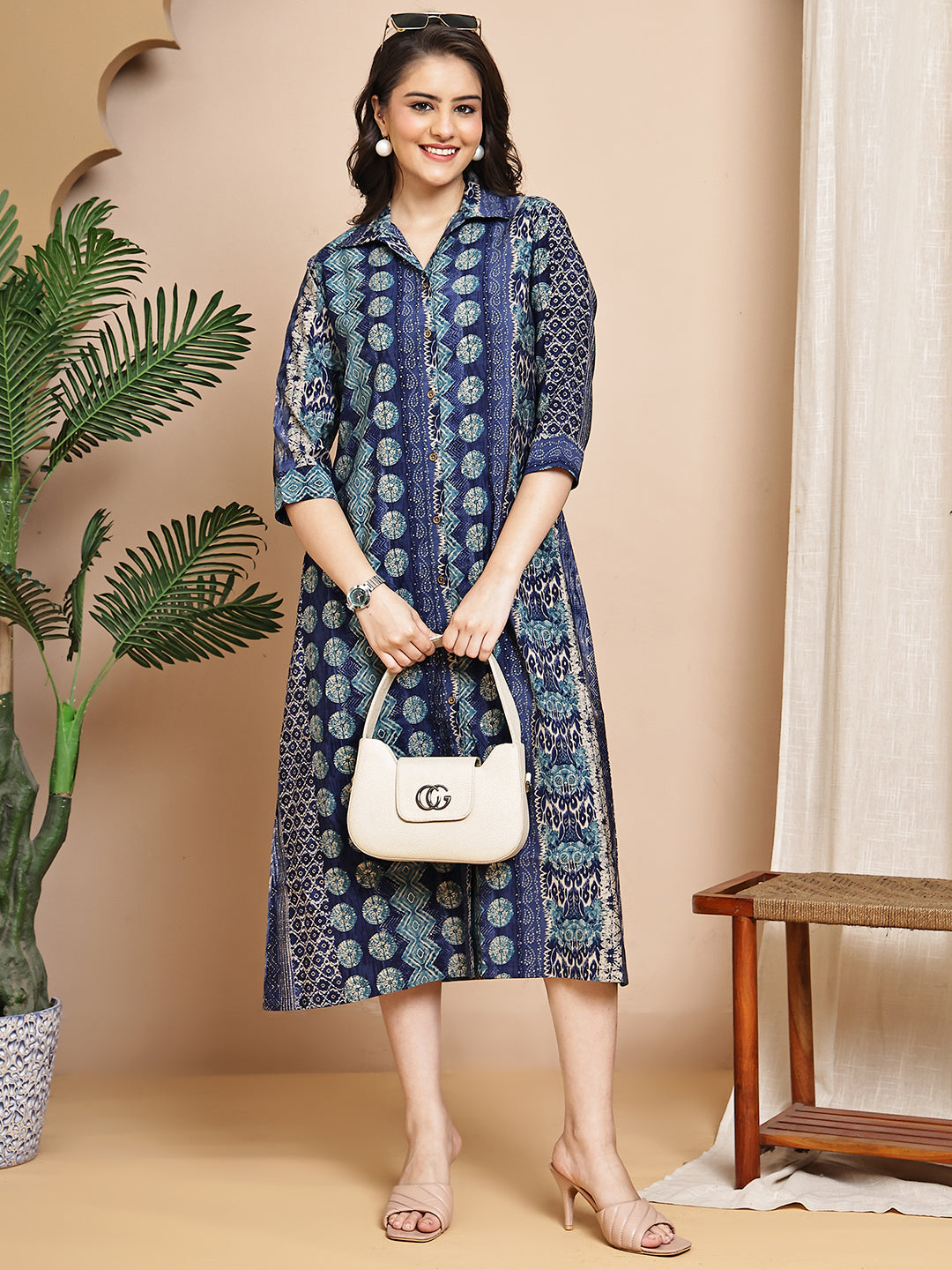 Woman wearing blue abstract printed dress