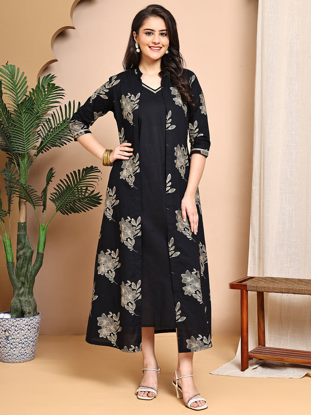 Woman wearing black floral printed cotton dress