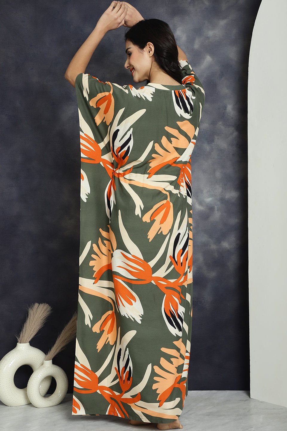 Back view of model in green printed Kaftan Dress