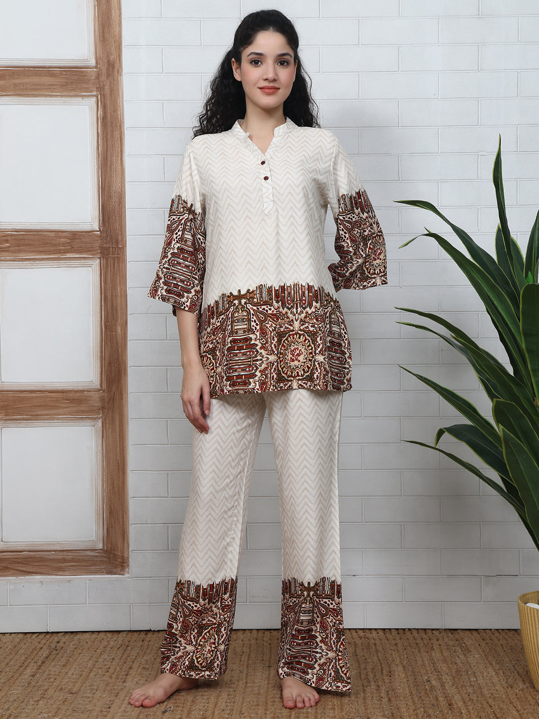 Woman wearing white abstract printed night suit