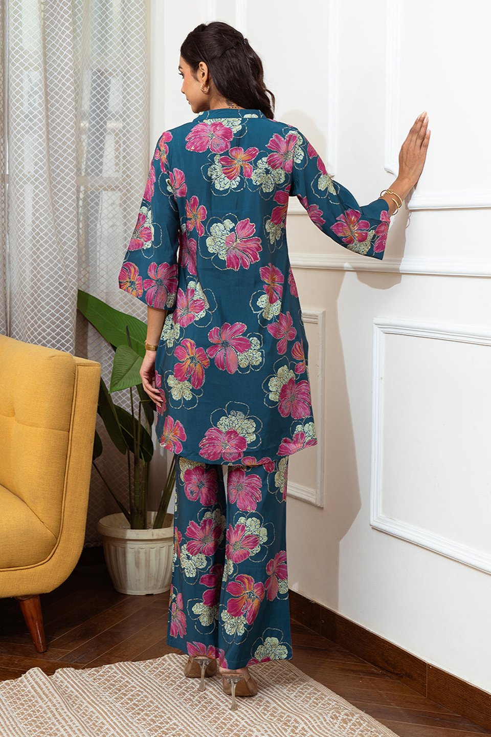 Back view of model styling light blue floral co-ord outfit