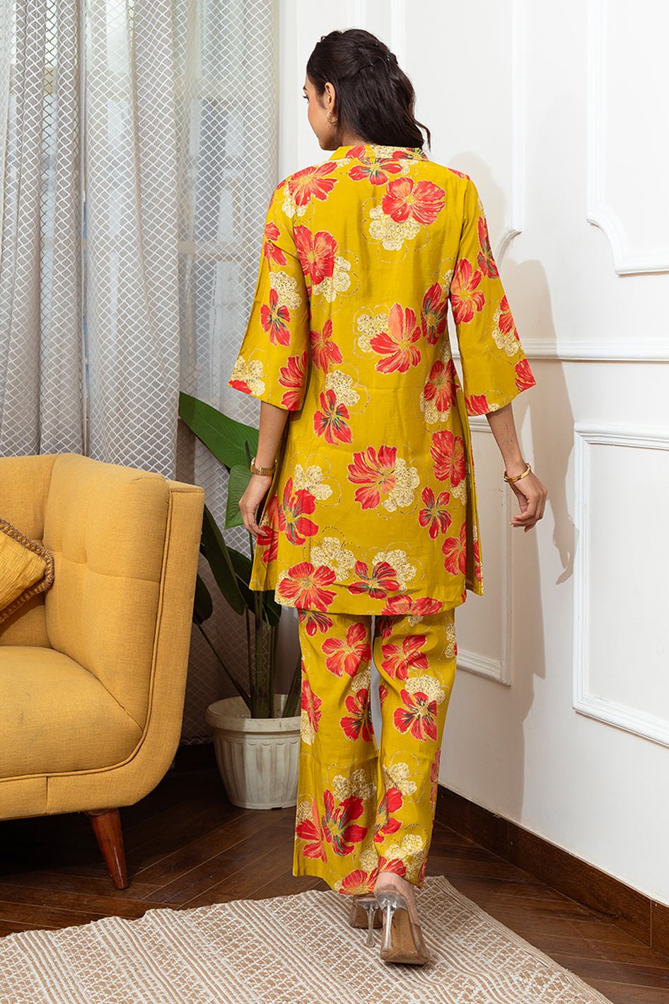 Back view of model styling Mustard floral co-ord outfit