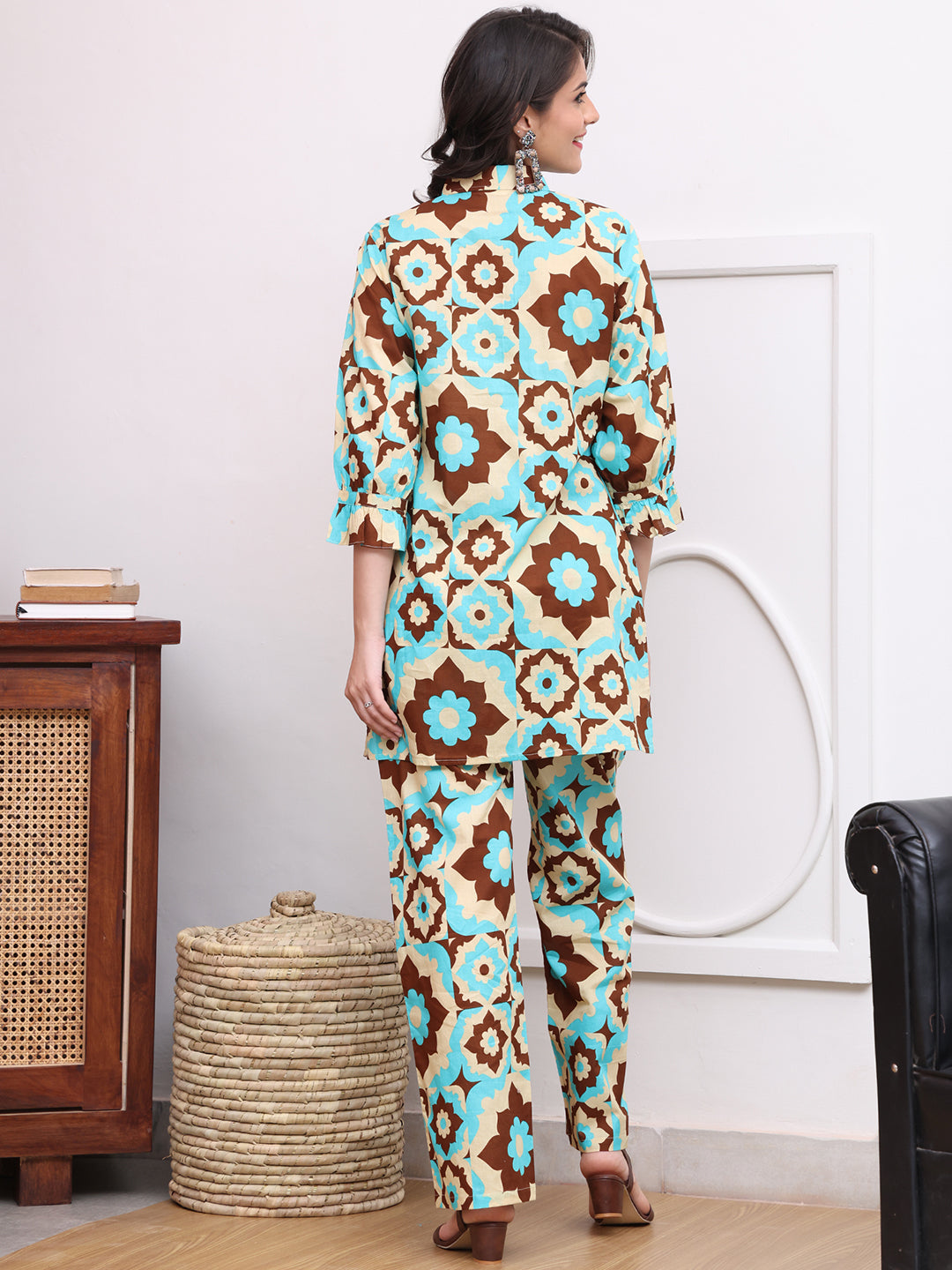 Back view of model styling bright abstract co-ord outfit