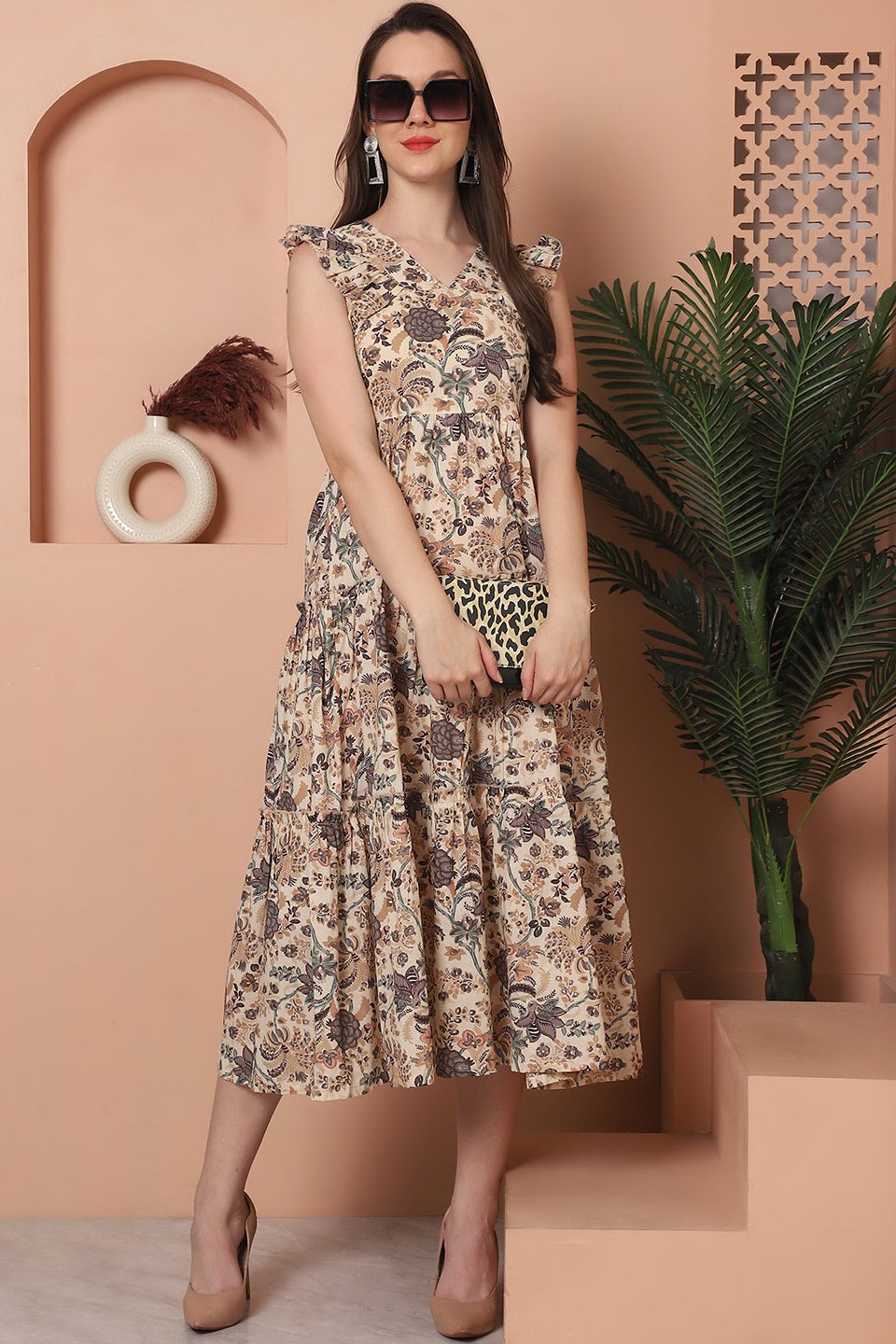 Woman wearing brown floral printed cotton dress
