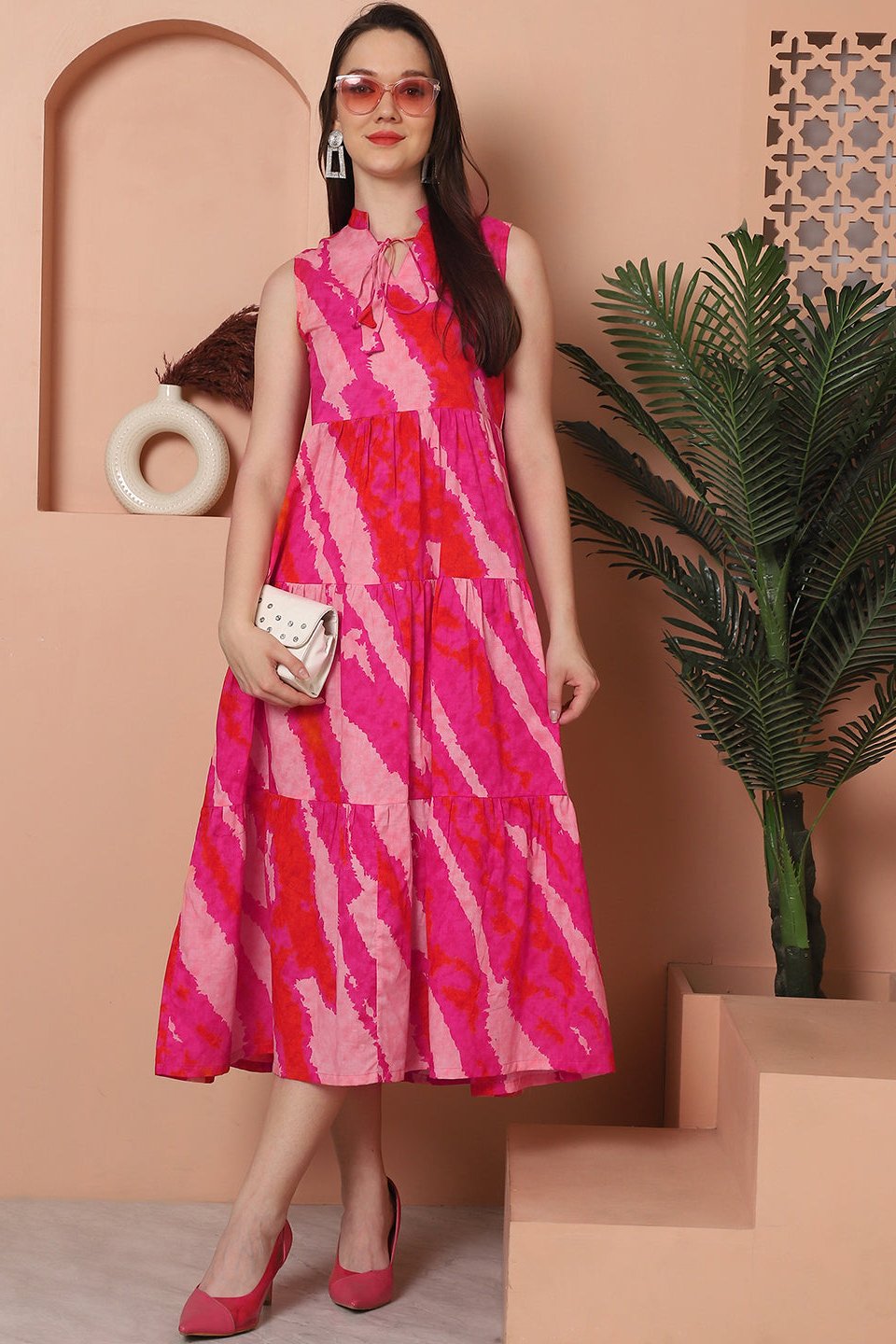 Woman wearing pink tie-dye cotton dress
