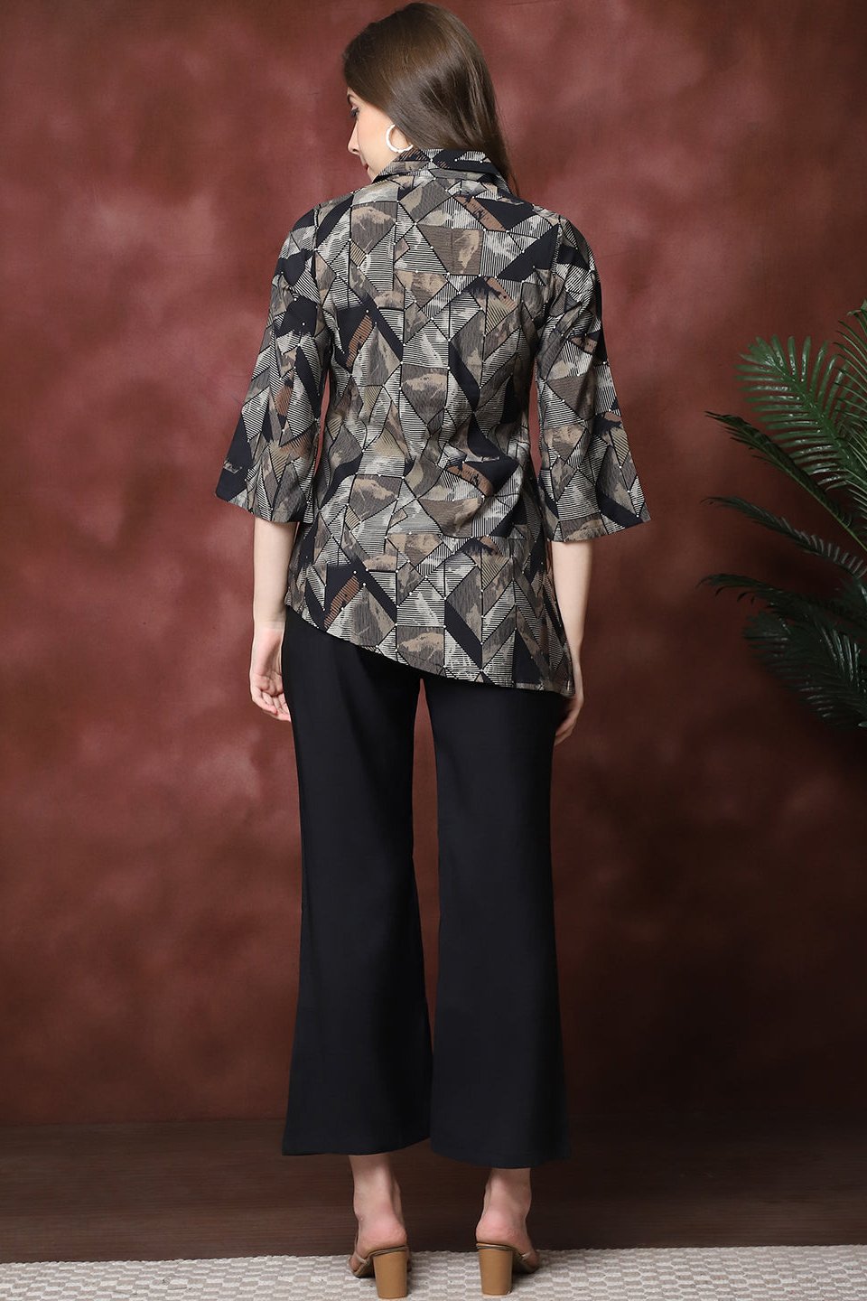 Back view of model styling Black co-ord outfit
