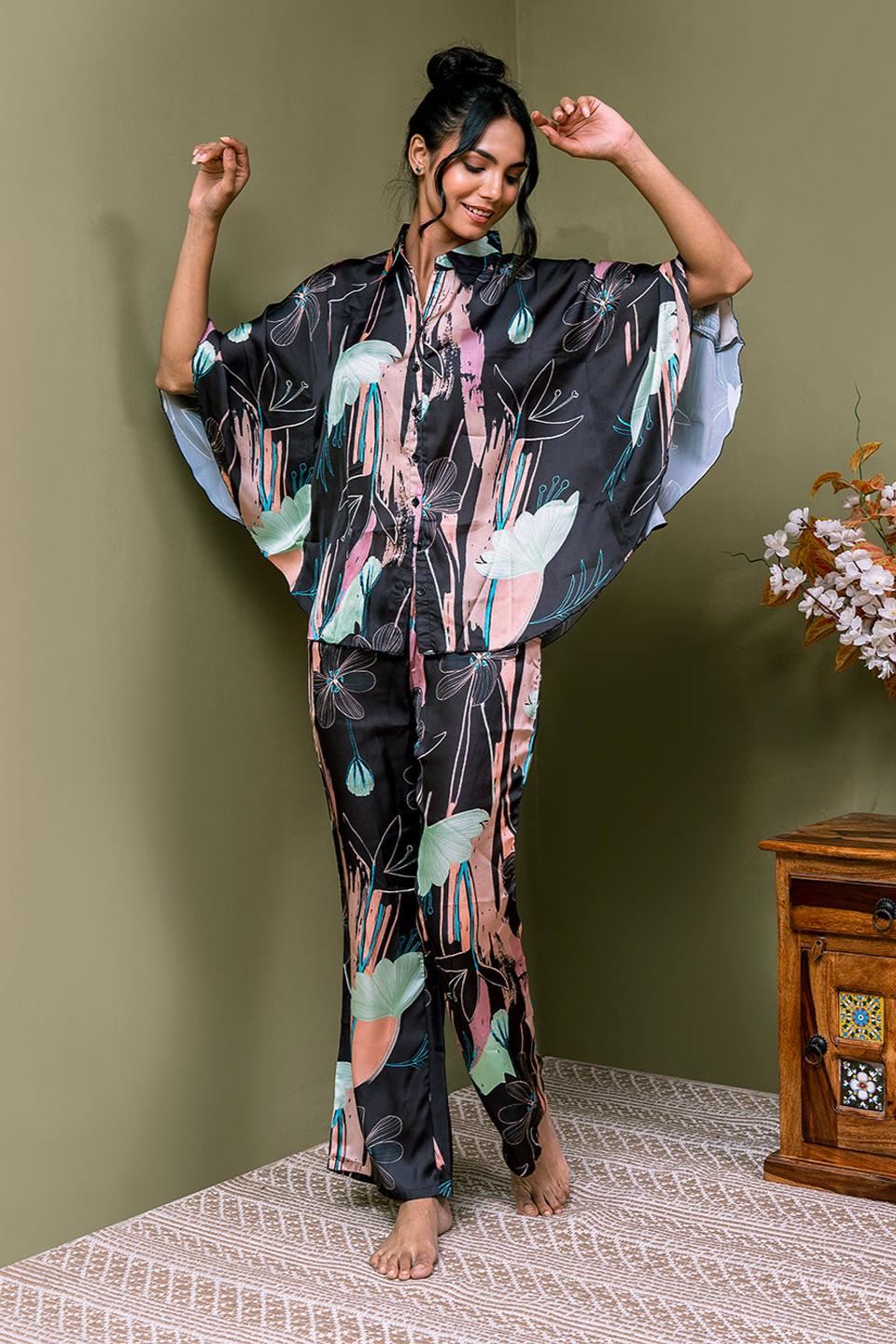 Woman wearing Black Printed Cotton Night Suit