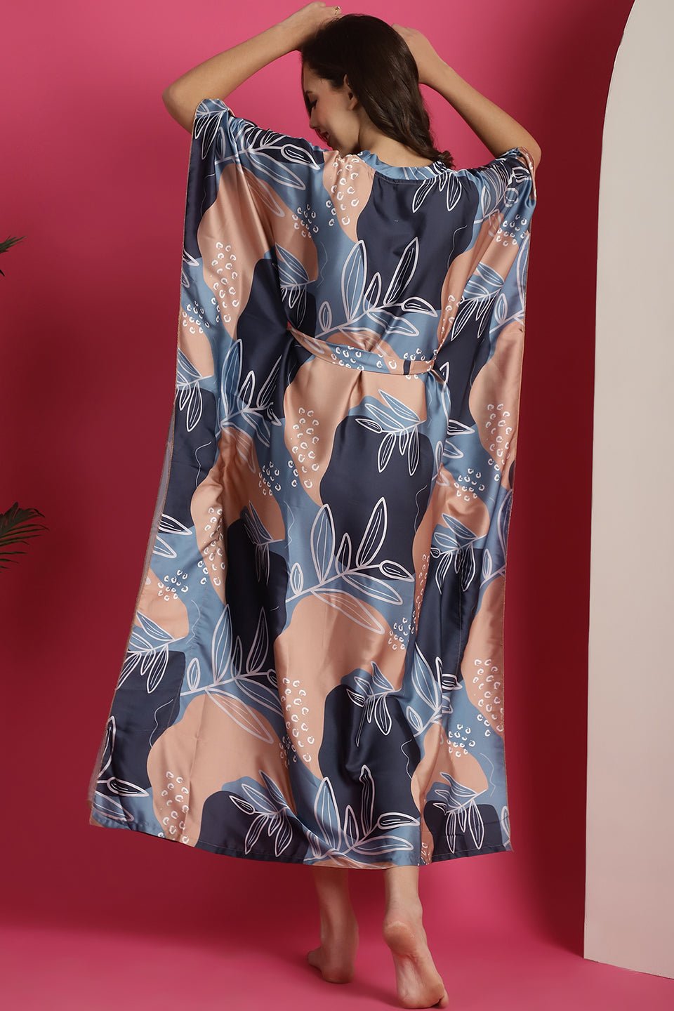 Close-up of silk satin fabric detail on Blue Kaftan Dress