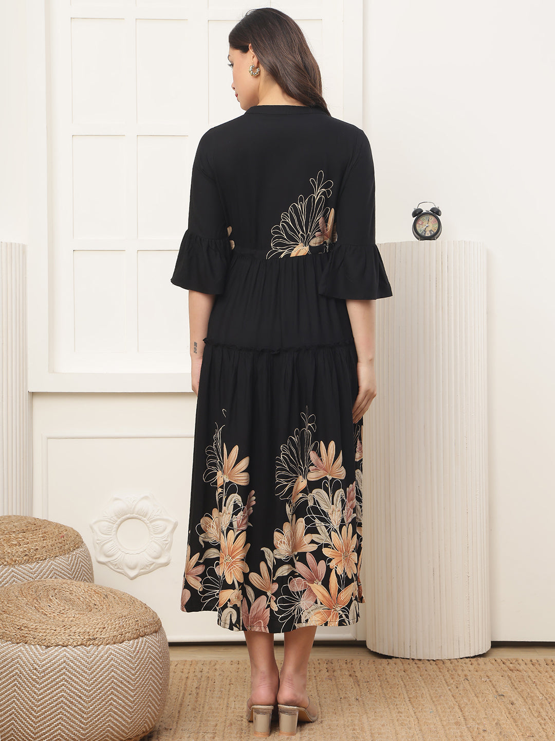 Back view of model in Black Printed Dresses