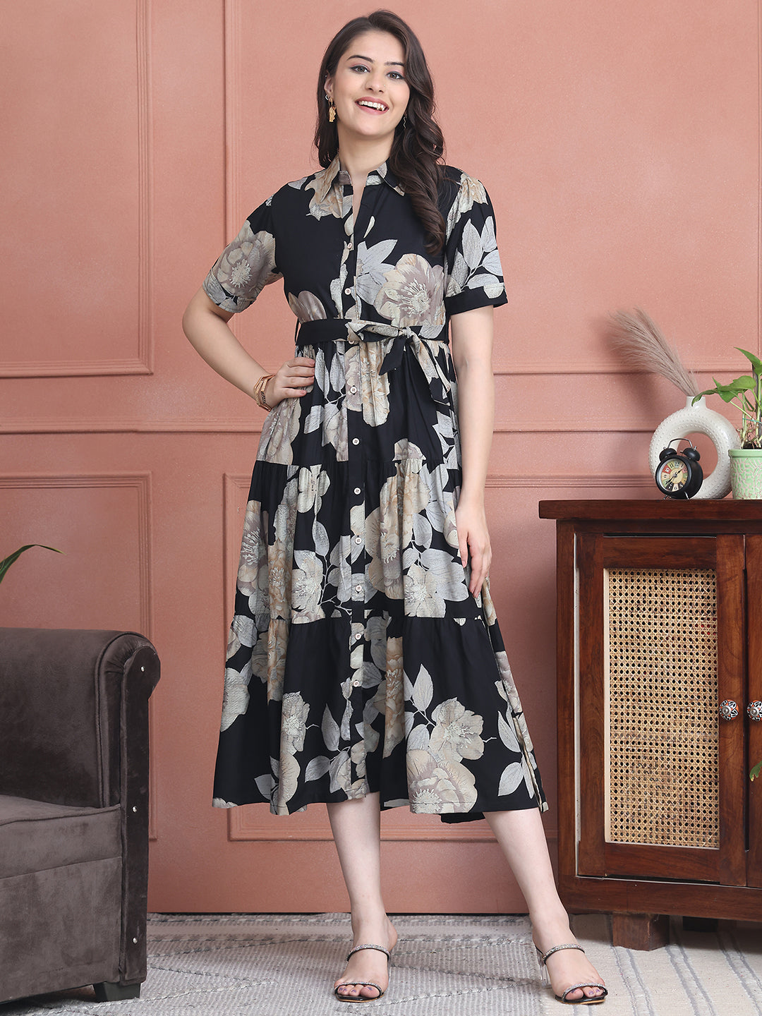 Woman wearing black floral printed dress