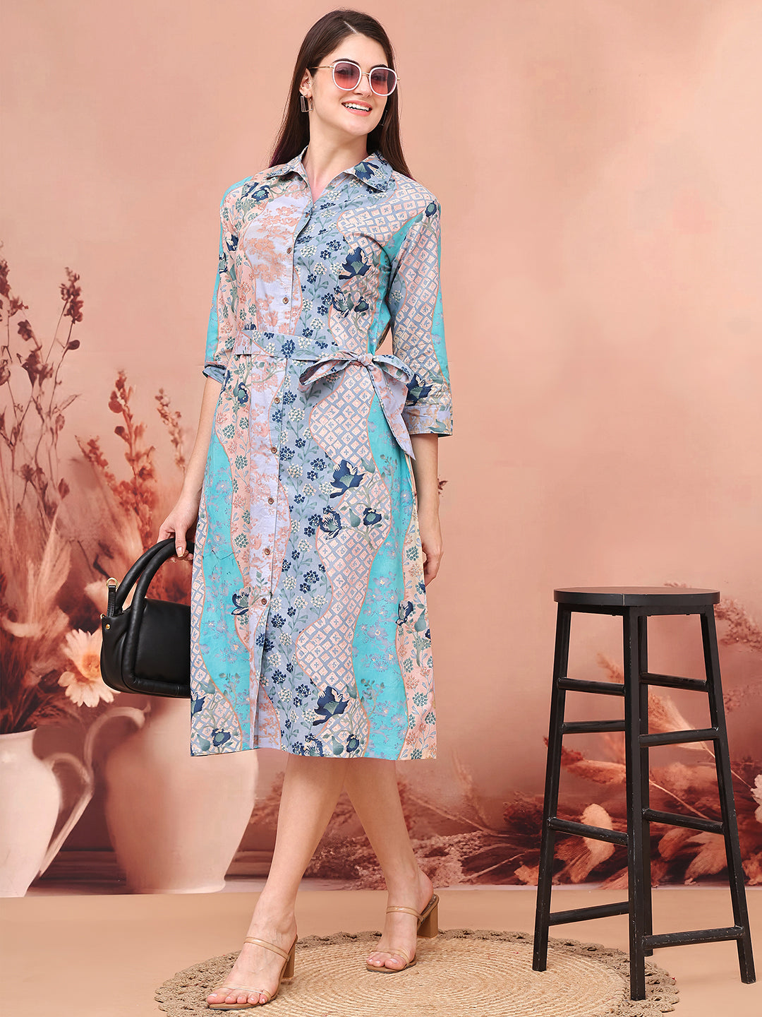 Woman wearing blue floral printed dress (