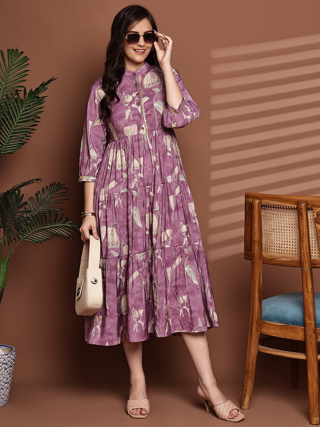 Woman wearing mauve floral printed Chanderi dress