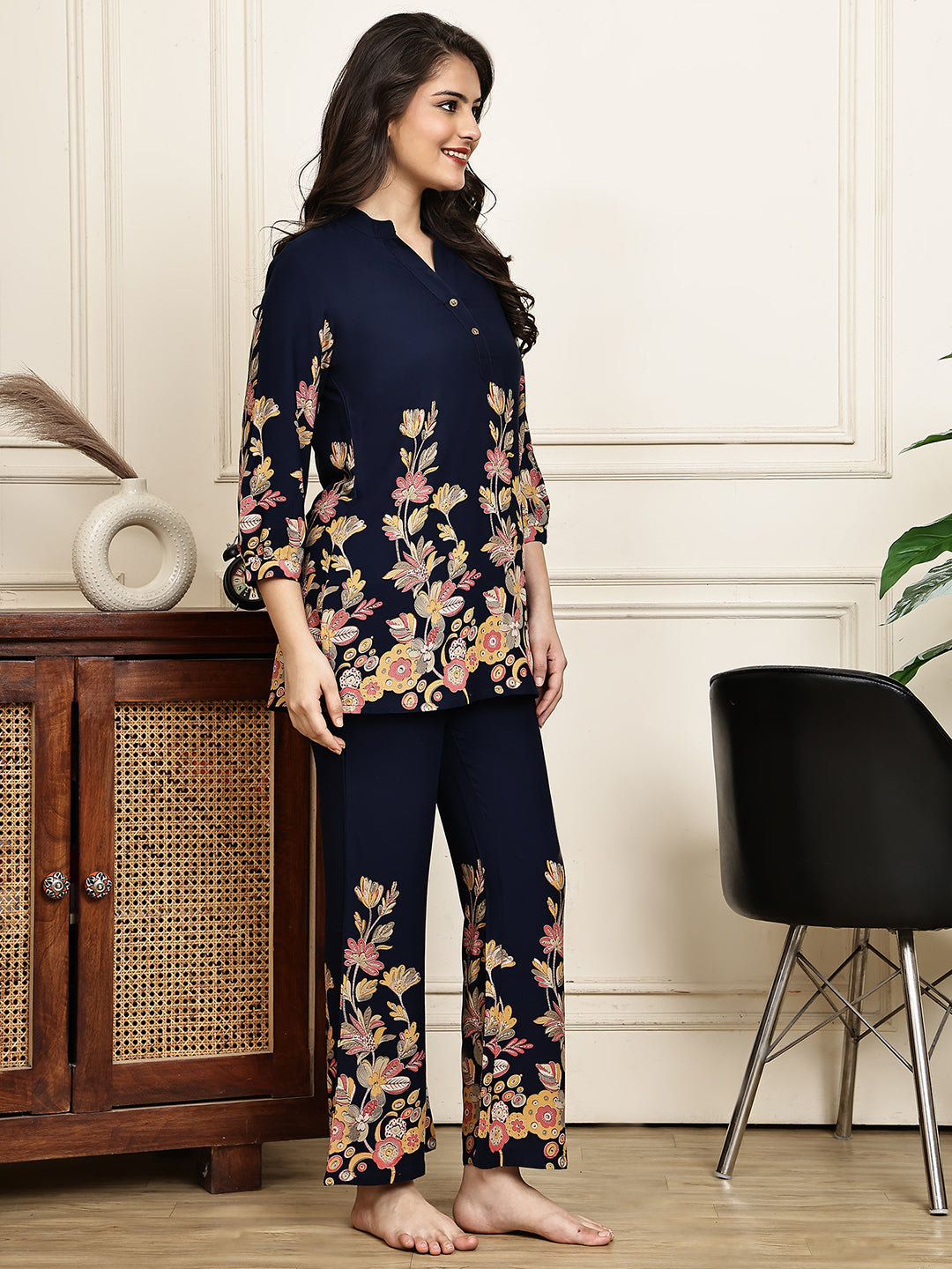 Lifestyle shot of floral printed navy blue Night Suit for Women