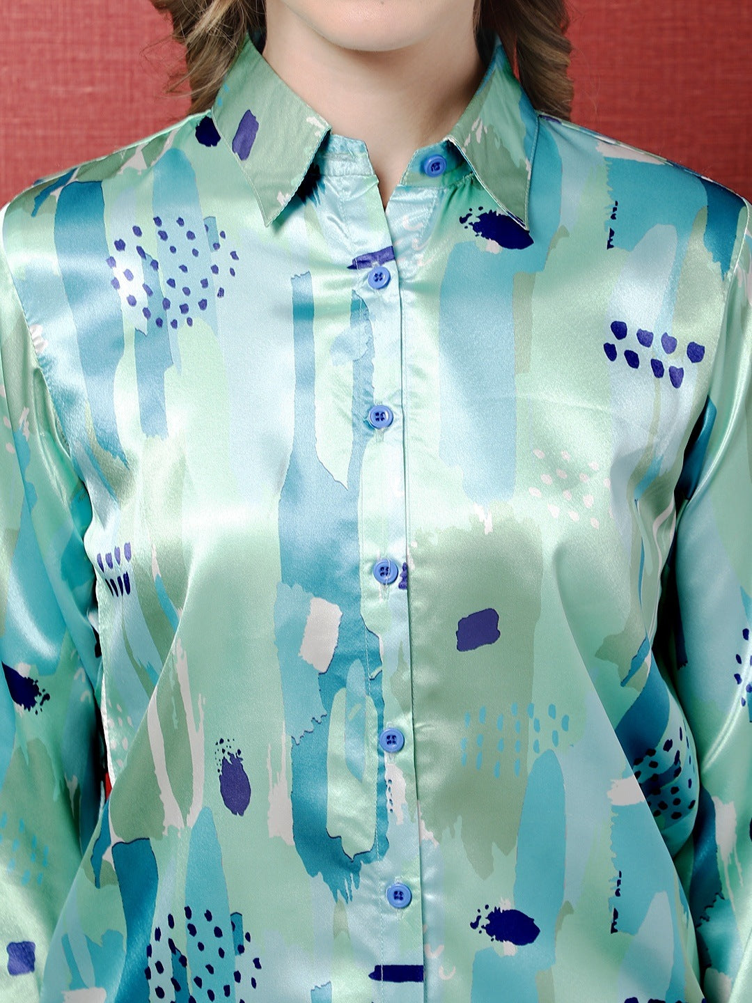 Back view of a model styling the blue satin co-ord outfit.