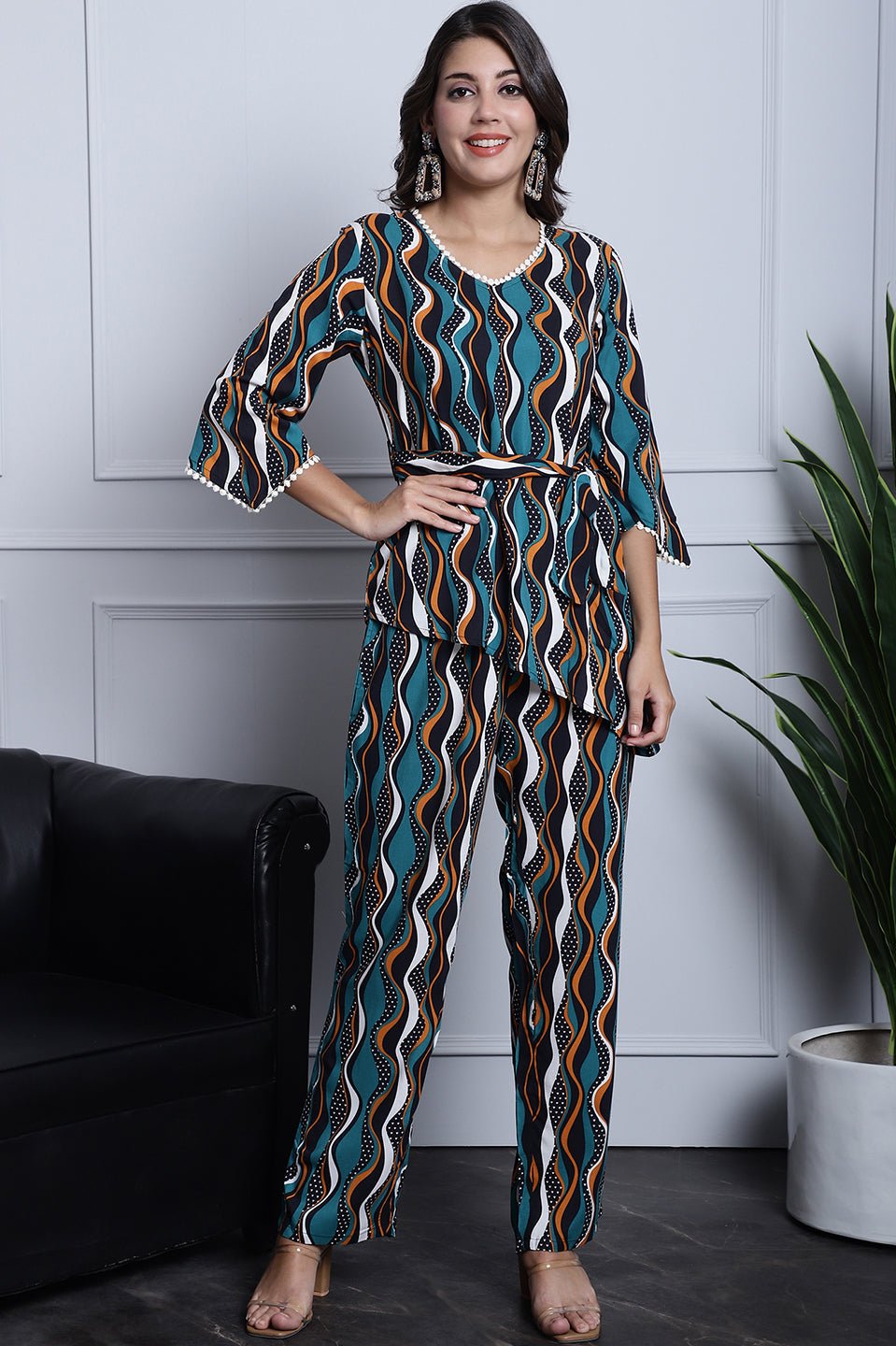 Green co-ord set with a round neck top and straight-fit trousers.