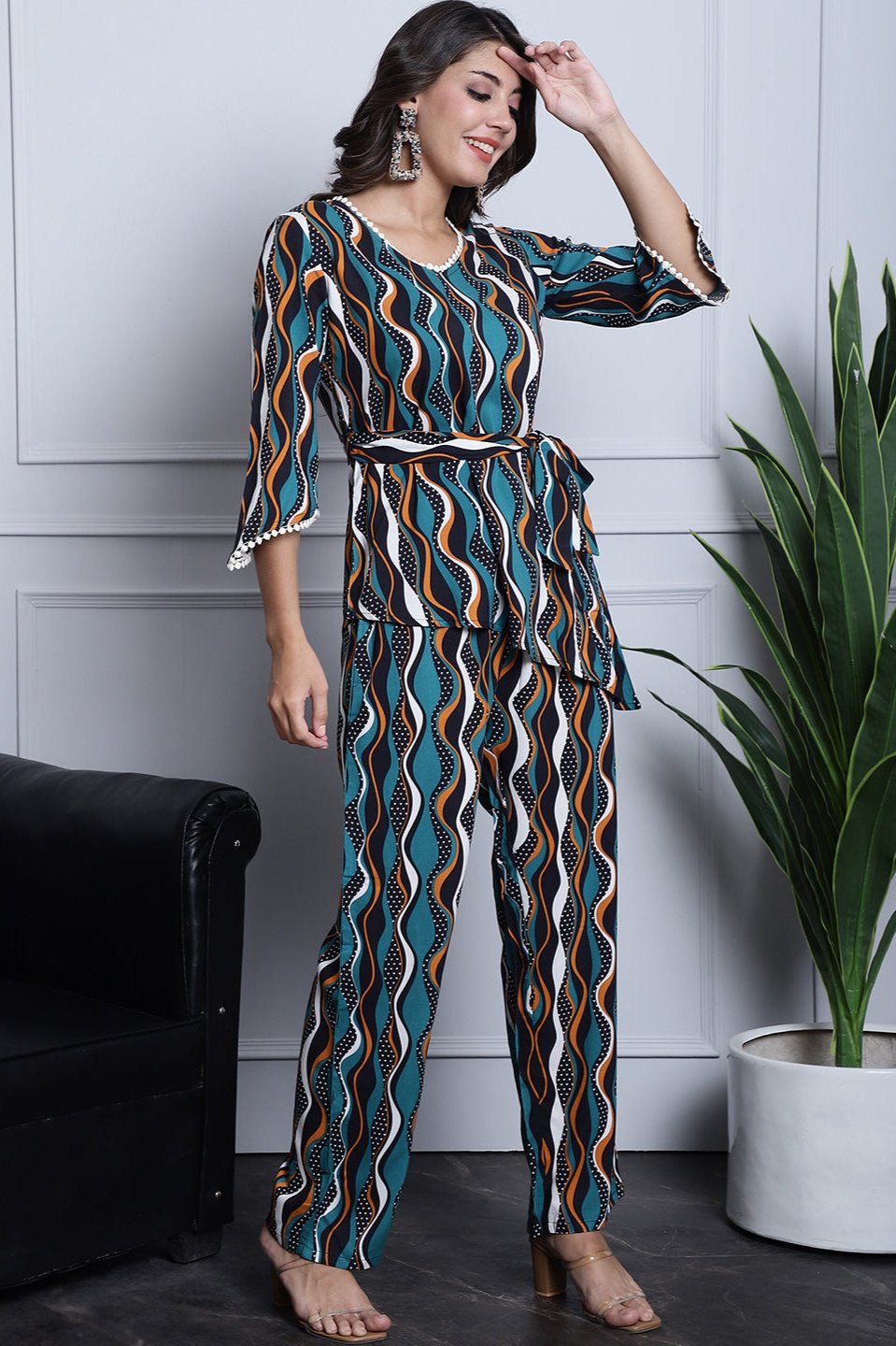 Green co-ord set with a round neck top and straight-fit trousers.