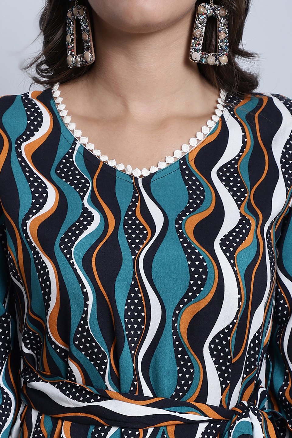 Lifestyle shot of the geometric print co-ord set outdoors.