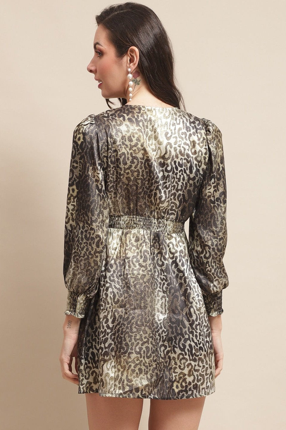 Back view of model in green satin dress