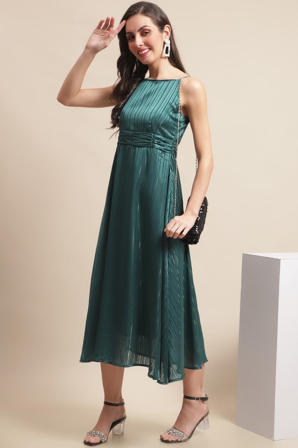 Close-up of georgette fabric detail on green dress for women