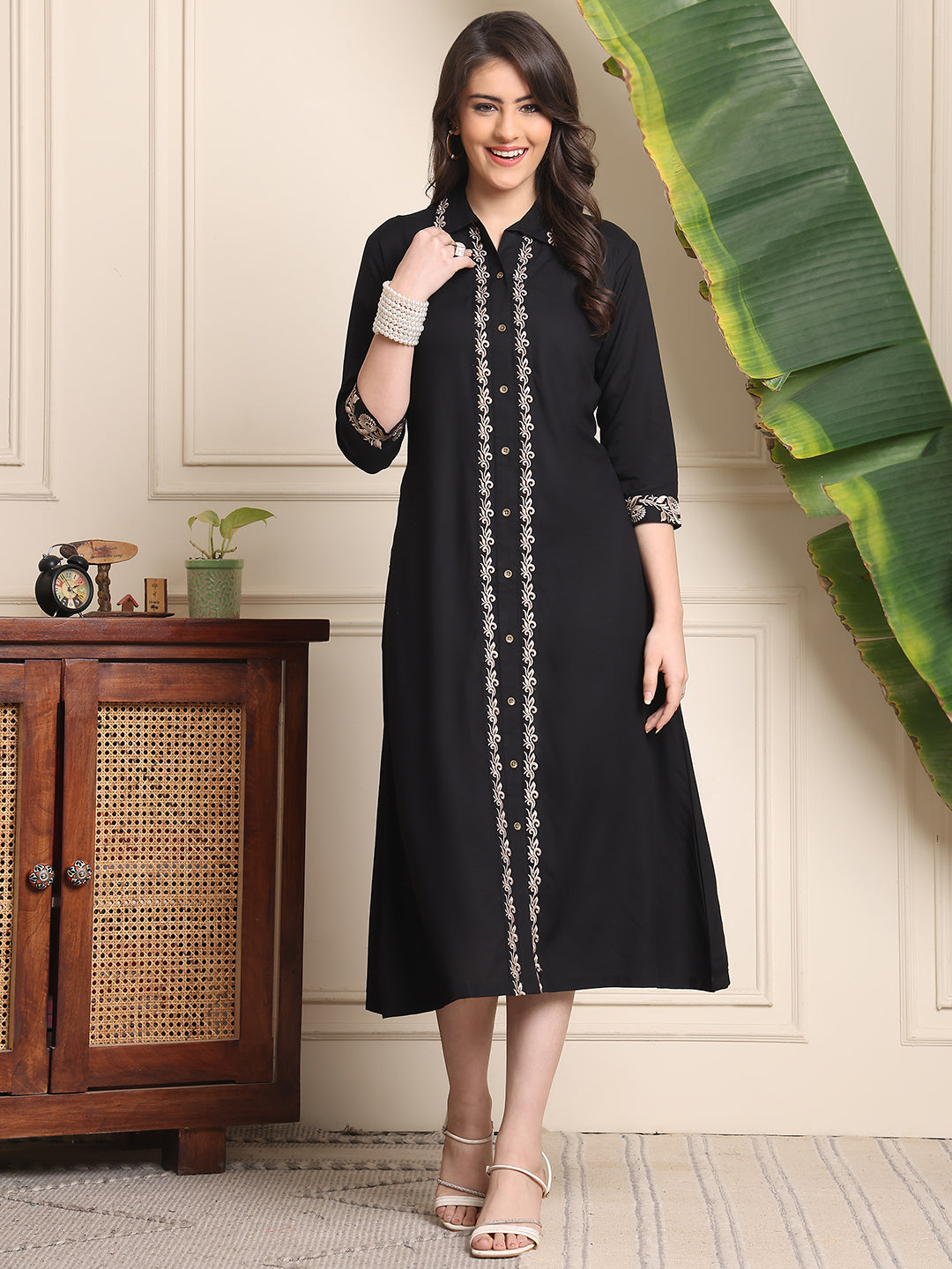 Close-up of embroidery on black viscose rayon dresses for women