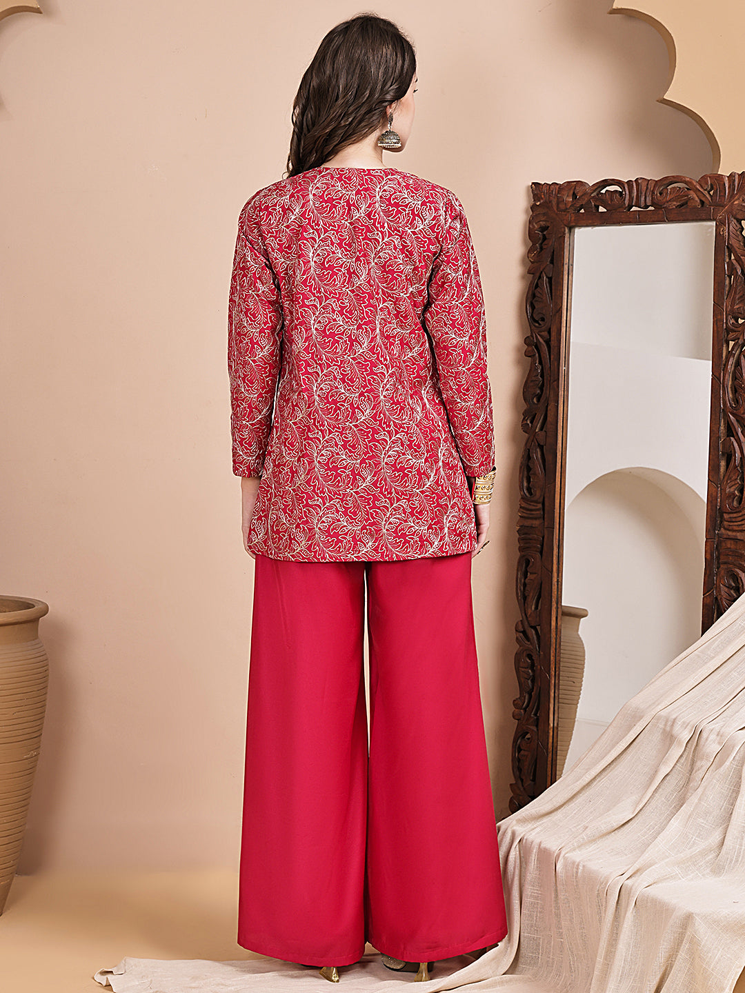 Back view of model in pink embroidered co-ord outfit