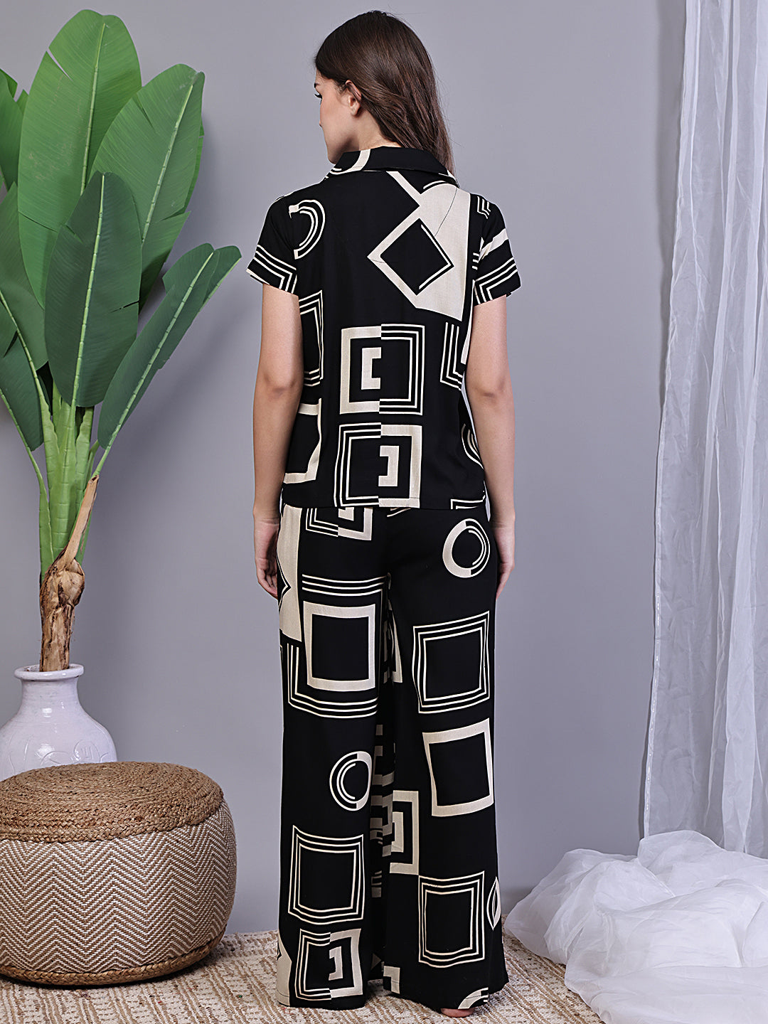 Back view of model in Black Printed Night Suit