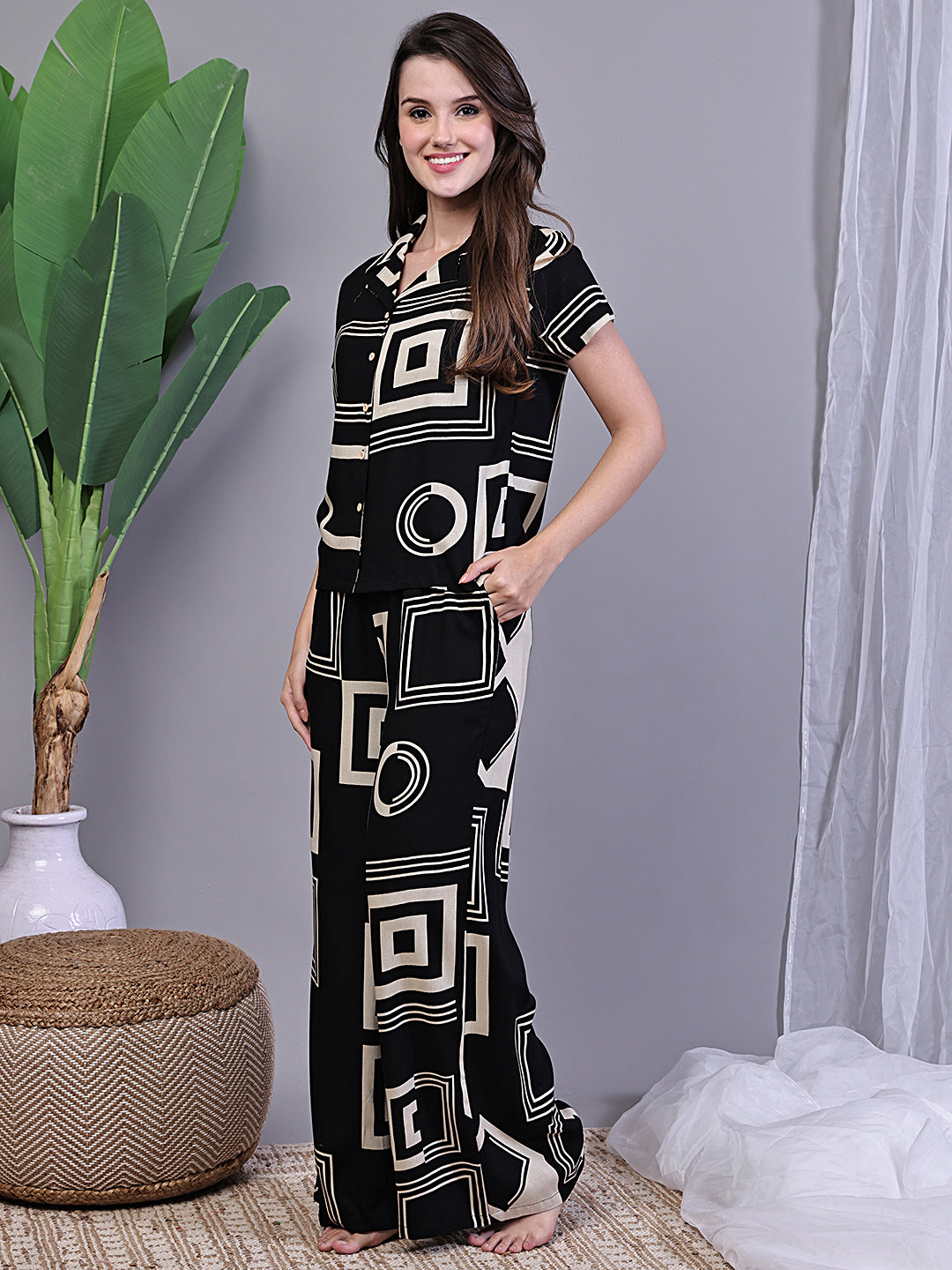 Lifestyle shot of Abstract Print Night Suit for Women lounging