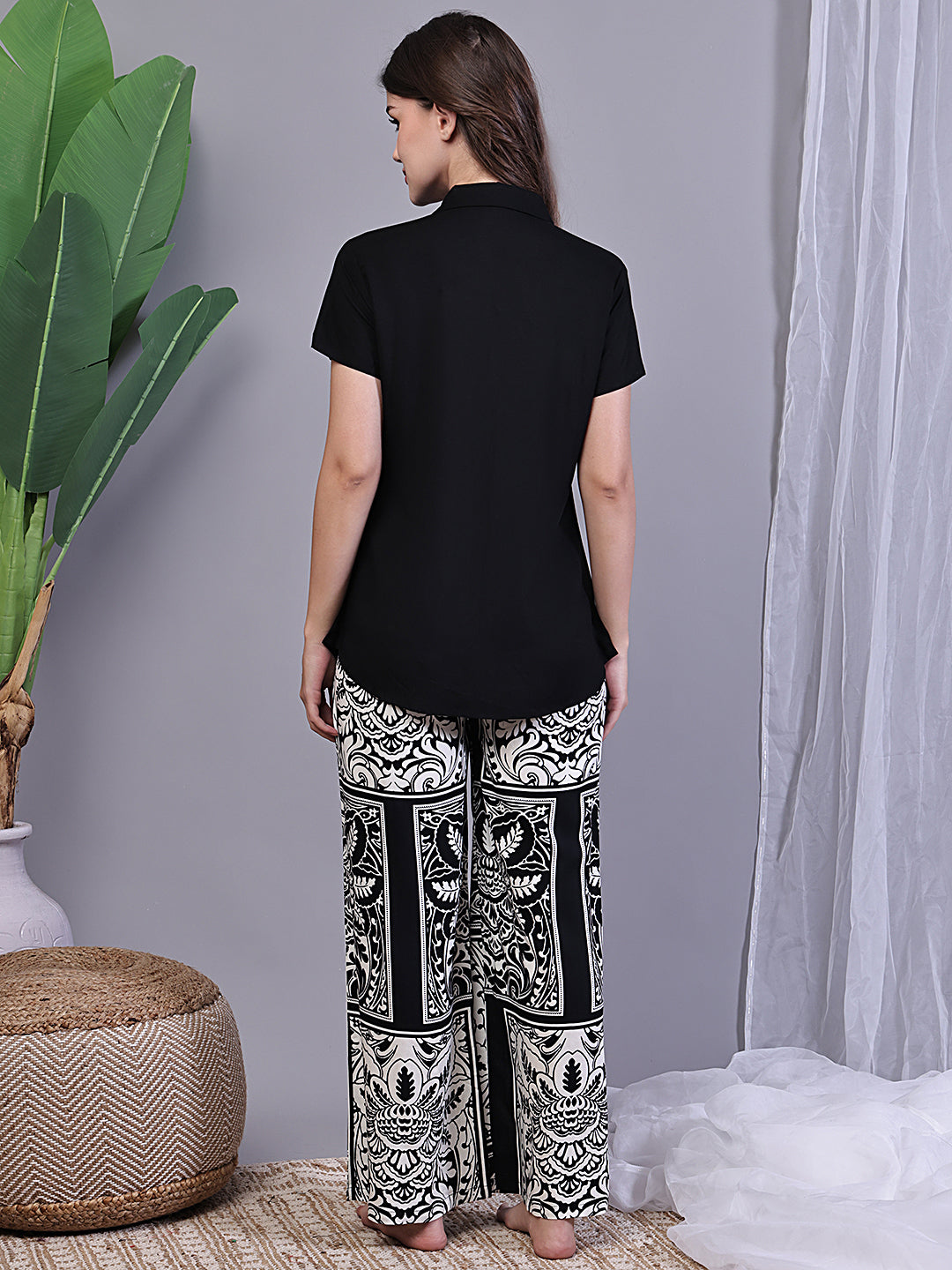 Back view of model in Black Abstract Printed Night Suit for Women