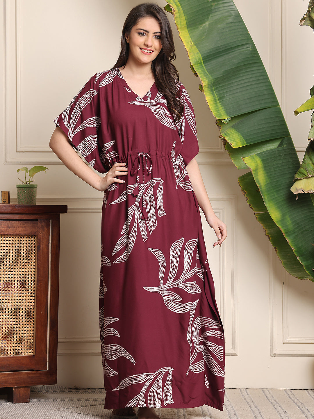 Woman wearing purple floral printed Kaftan Dress