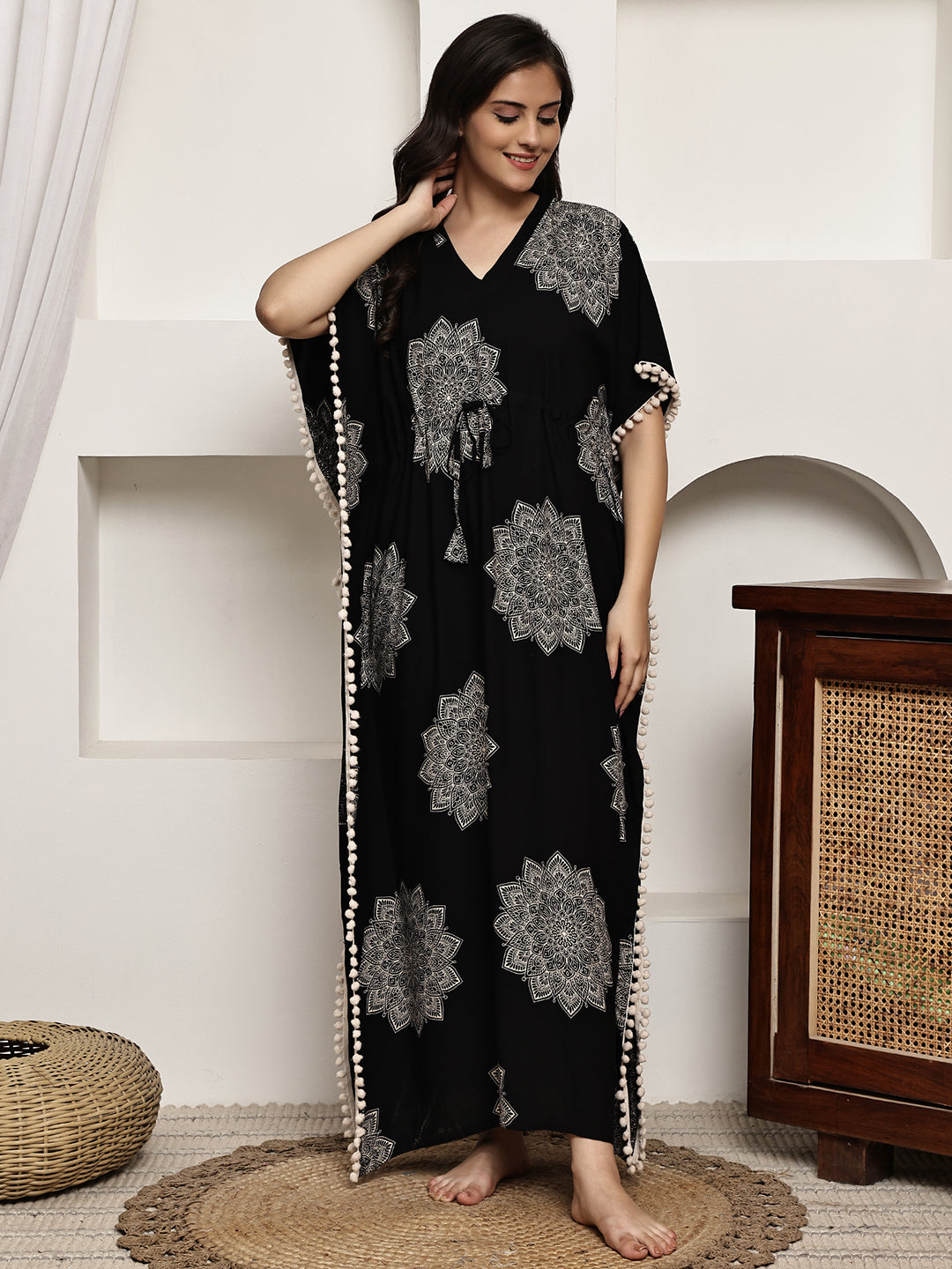 Woman wearing black abstract printed Kaftan Dress 
