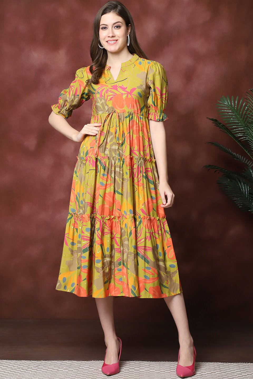 Woman wearing mustard floral printed dress