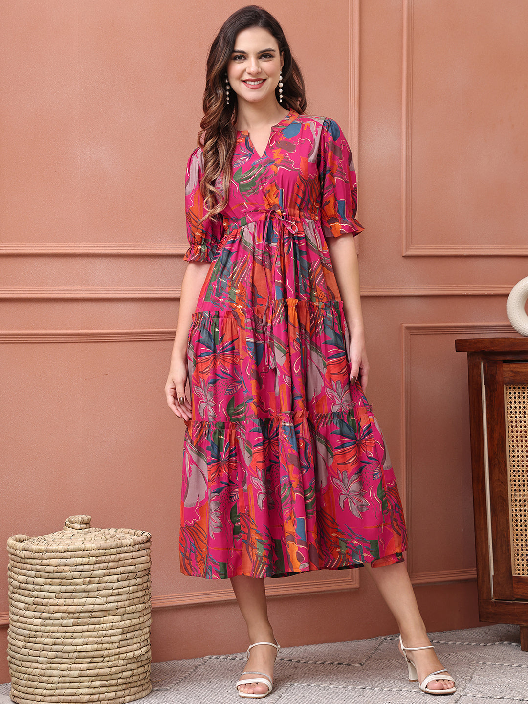 Woman wearing pink floral printed Chanderi dress