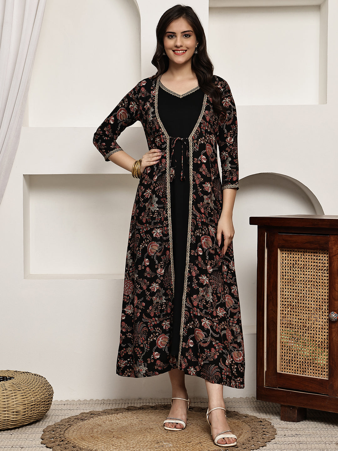 Woman wearing black ethnic floral dress
