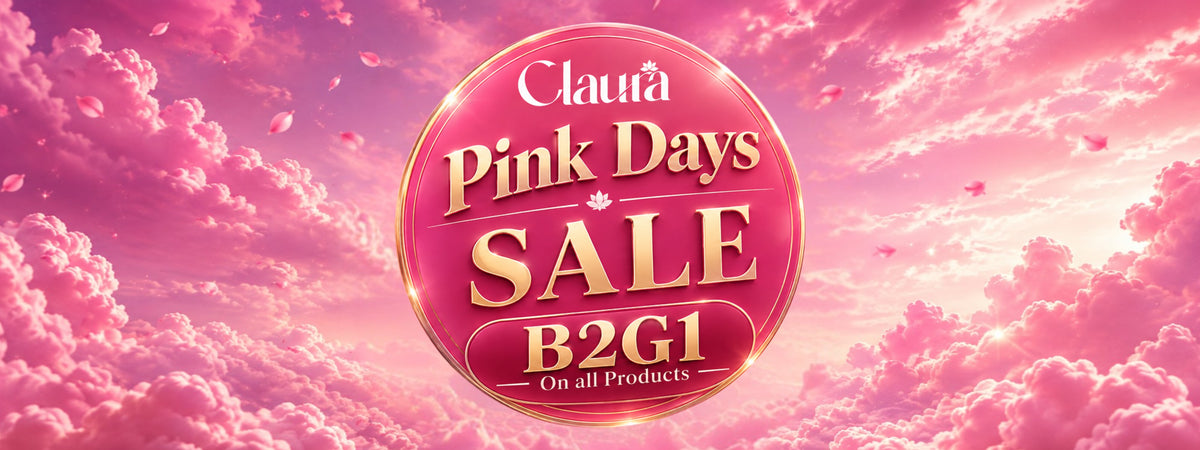 A promotional sale graphic with a large pink circular badge reading 'Claudia Pink Days SALE B2G1 On all Products' centered over a pink sky with clouds and falling petals.