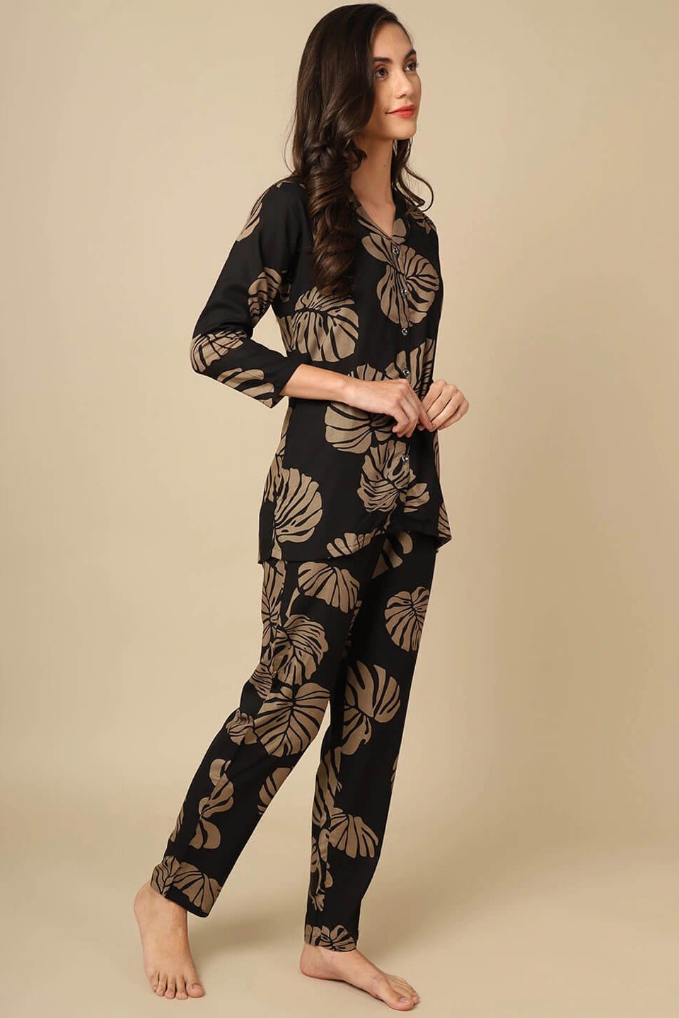 Back view of model in Black Printed Night Suit